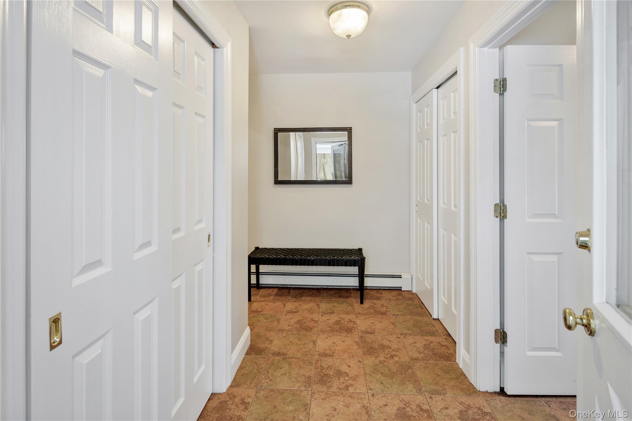 14 Adams Farm Road Katonah, NY 10536 - Photo 28 of 47 Main floor mud room with ample closet storage and door to deck