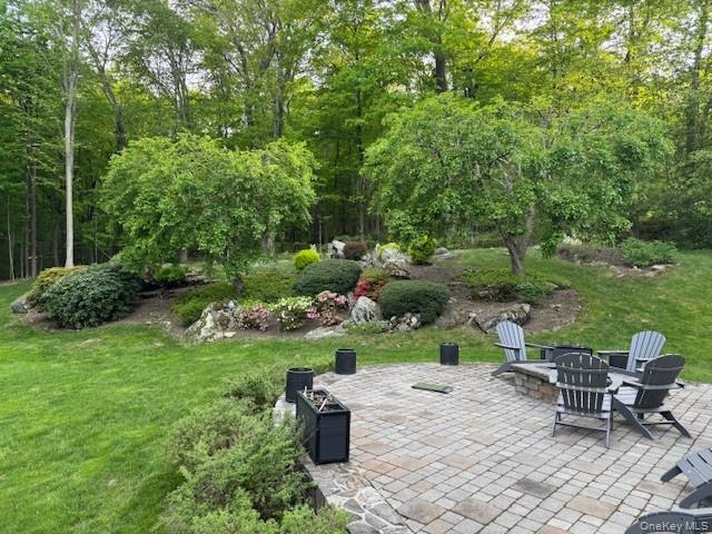 14 Adams Farm Road Katonah, NY 10536 - Photo 4 of 47 Back patio with firepit and professional landscaping