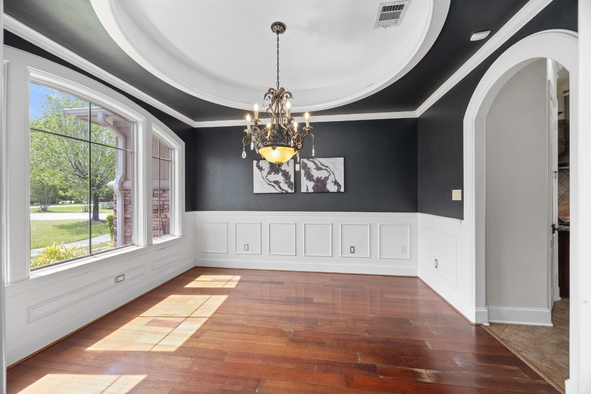 4447 Chateau Creek Way Spring, TX 77386 - Photo 11 of 50 a view of an entryway with wooden floor and windows