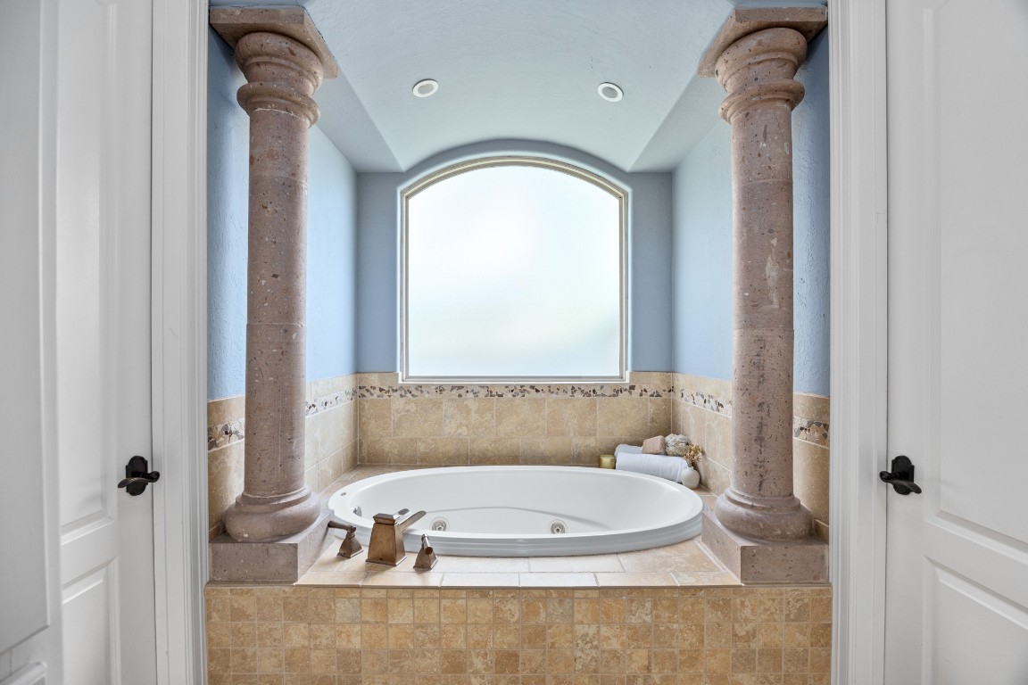4447 Chateau Creek Way Spring, TX 77386 - Photo 22 of 50 a bathroom with a tub and shower