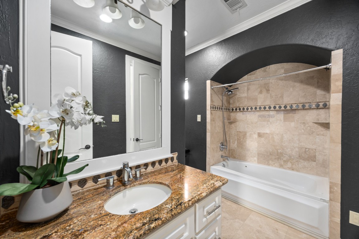 4447 Chateau Creek Way Spring, TX 77386 - Photo 27 of 50 a bathroom with a granite countertop sink a mirror and a shower