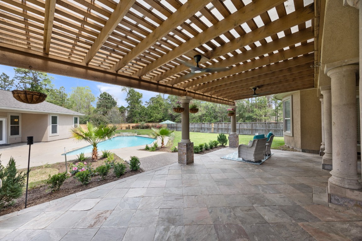 4447 Chateau Creek Way Spring, TX 77386 - Photo 34 of 50 a view of a porch with furniture and garden