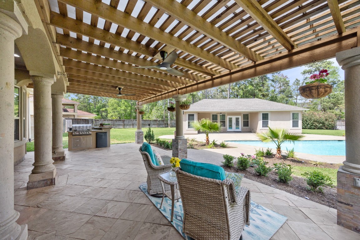 4447 Chateau Creek Way Spring, TX 77386 - Photo 35 of 50 a front view of a house with garden and patio