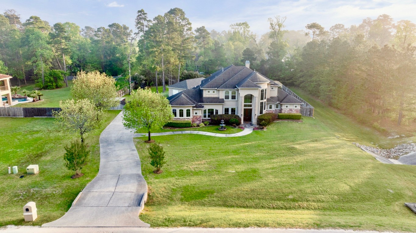 4447 Chateau Creek Way Spring, TX 77386 - Photo 50 of 50 a aerial view of a house with swimming pool garden and trees