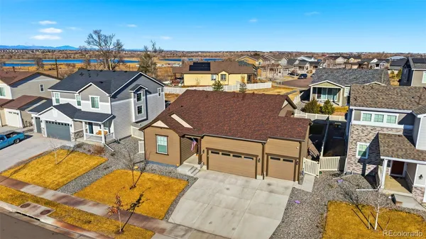 an aerial view of a house with a swimming pool
