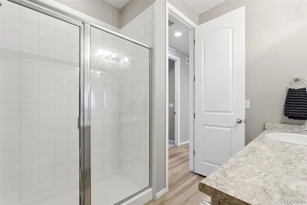 a bathroom with a bathtub and shower