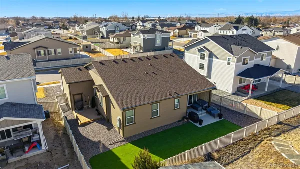 an aerial view of a house with a big yard