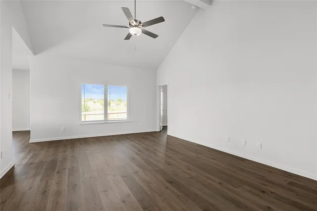 a view of kitchen with cabinets and wooden floor