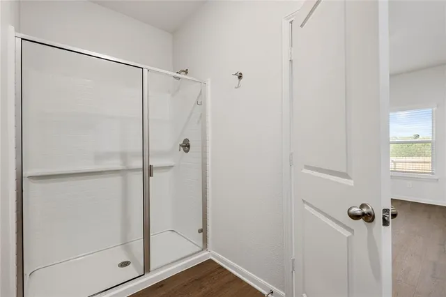 a bathroom with a granite countertop sink a mirror and a