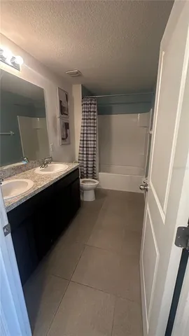 a bathroom with a sink a vanity and a mirror