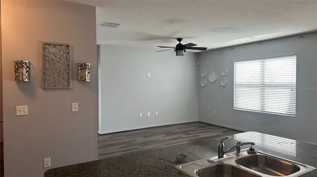 a view of empty room with windows