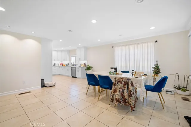 a dinning room and livingroom with furniture