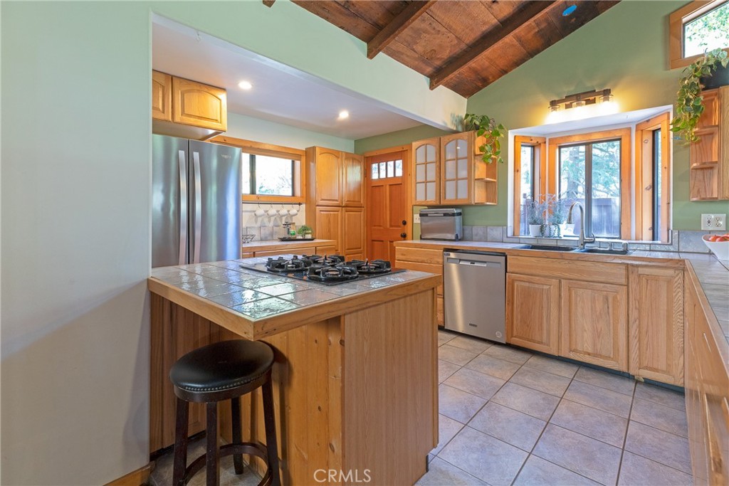 31311 Silverado Canyon Road Silverado, CA 92676 - Photo 21 of 37 a kitchen with a sink stove and cabinets