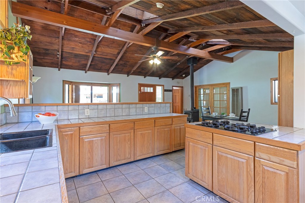 31311 Silverado Canyon Road Silverado, CA 92676 - Photo 24 of 37 a large kitchen with cabinets and a wooden floors