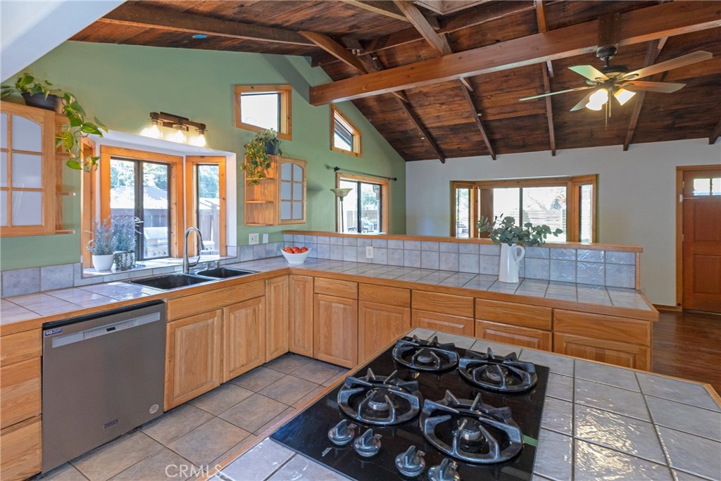 31311 Silverado Canyon Road Silverado, CA 92676 - Photo 6 of 37 a large kitchen with a large window and stainless steel appliances