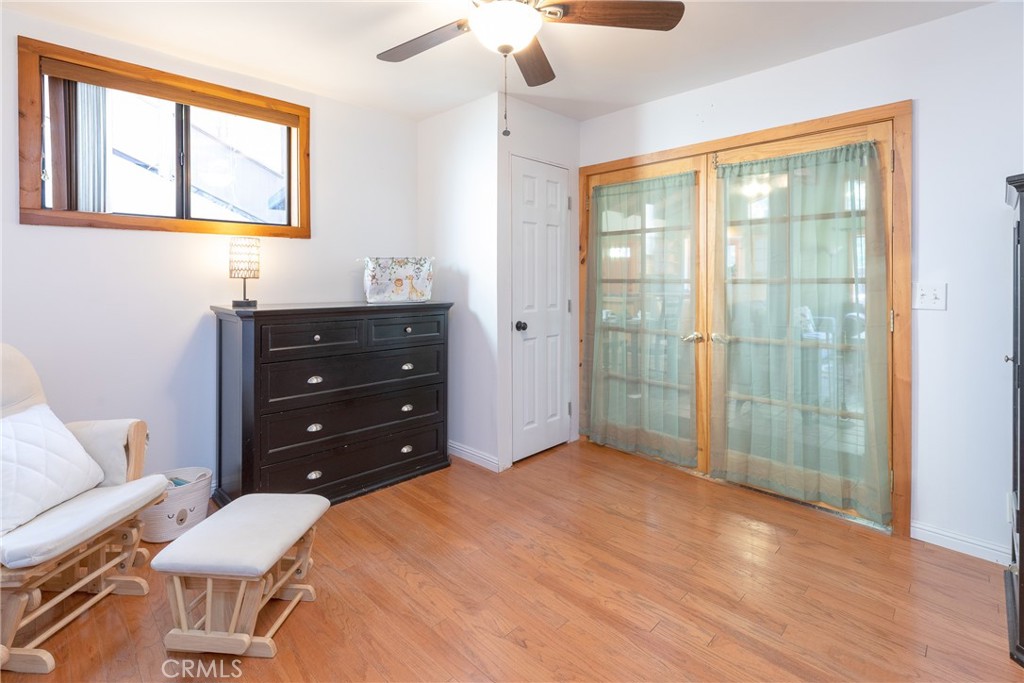 31311 Silverado Canyon Road Silverado, CA 92676 - Photo 10 of 37 a bedroom with a bed and a chandelier