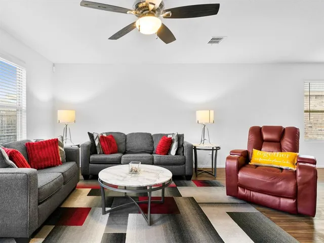 a living room with furniture and a couch