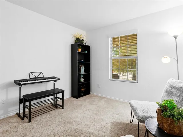 a view of workspace with furniture and window