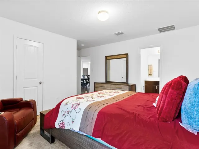 a bedroom with a bed and closet