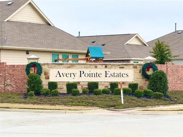 a view of a house with a yard and plants