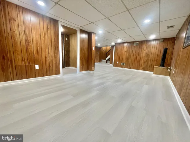 a bathroom with a double vanity sink mirror and shower