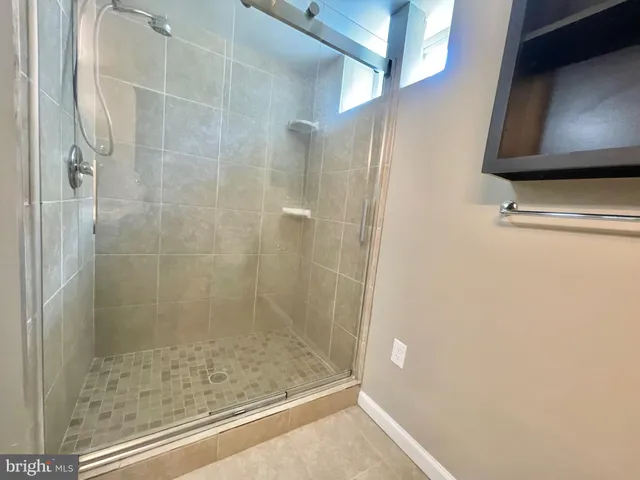 a utility room with cabinets washer and dryer