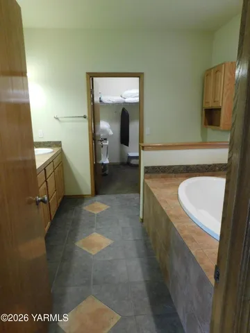 a bathroom with a sink and mirror