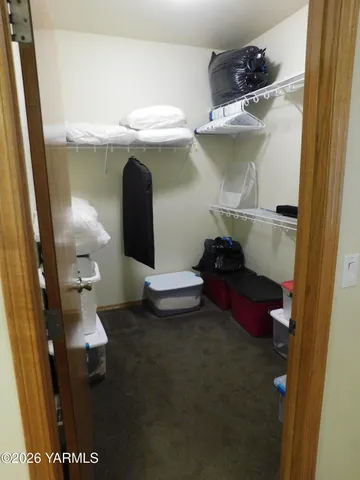 a bathroom with a toilet and a mirror