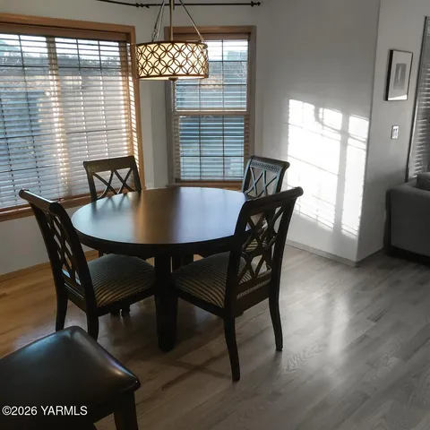 a view of a dining room with furniture and window