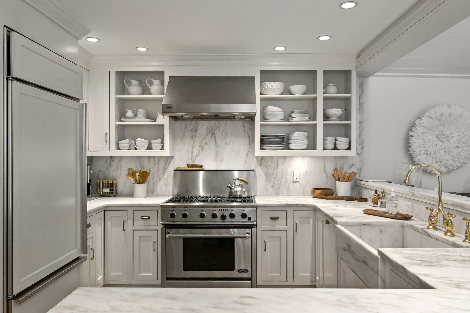 33 Tory Hole Road Darien, CT 06820 - Photo 14 of 51 a kitchen with stainless steel appliances granite countertop a sink stove and refrigerator