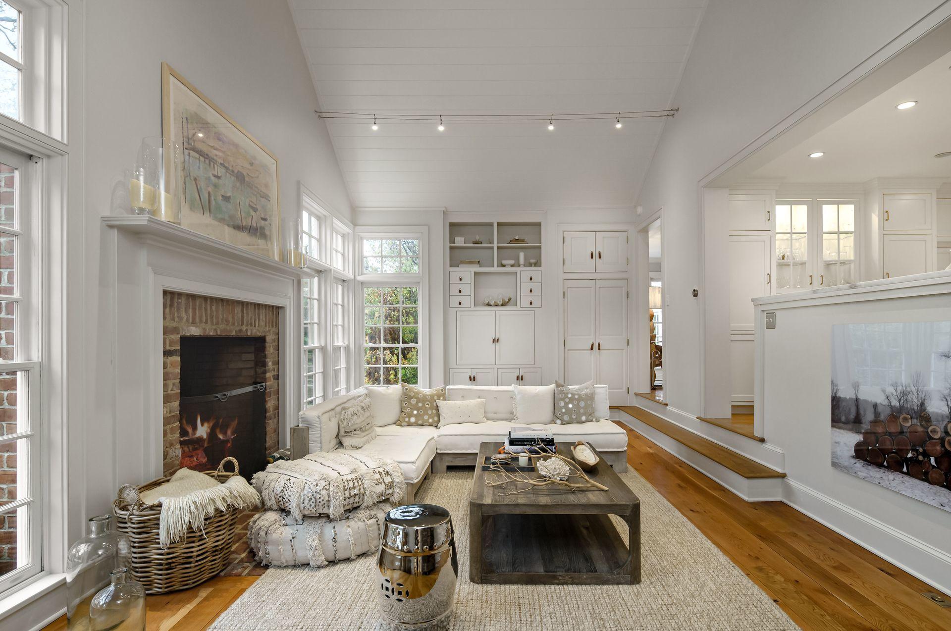 33 Tory Hole Road Darien, CT 06820 - Photo 19 of 51 a living room with furniture and a fireplace