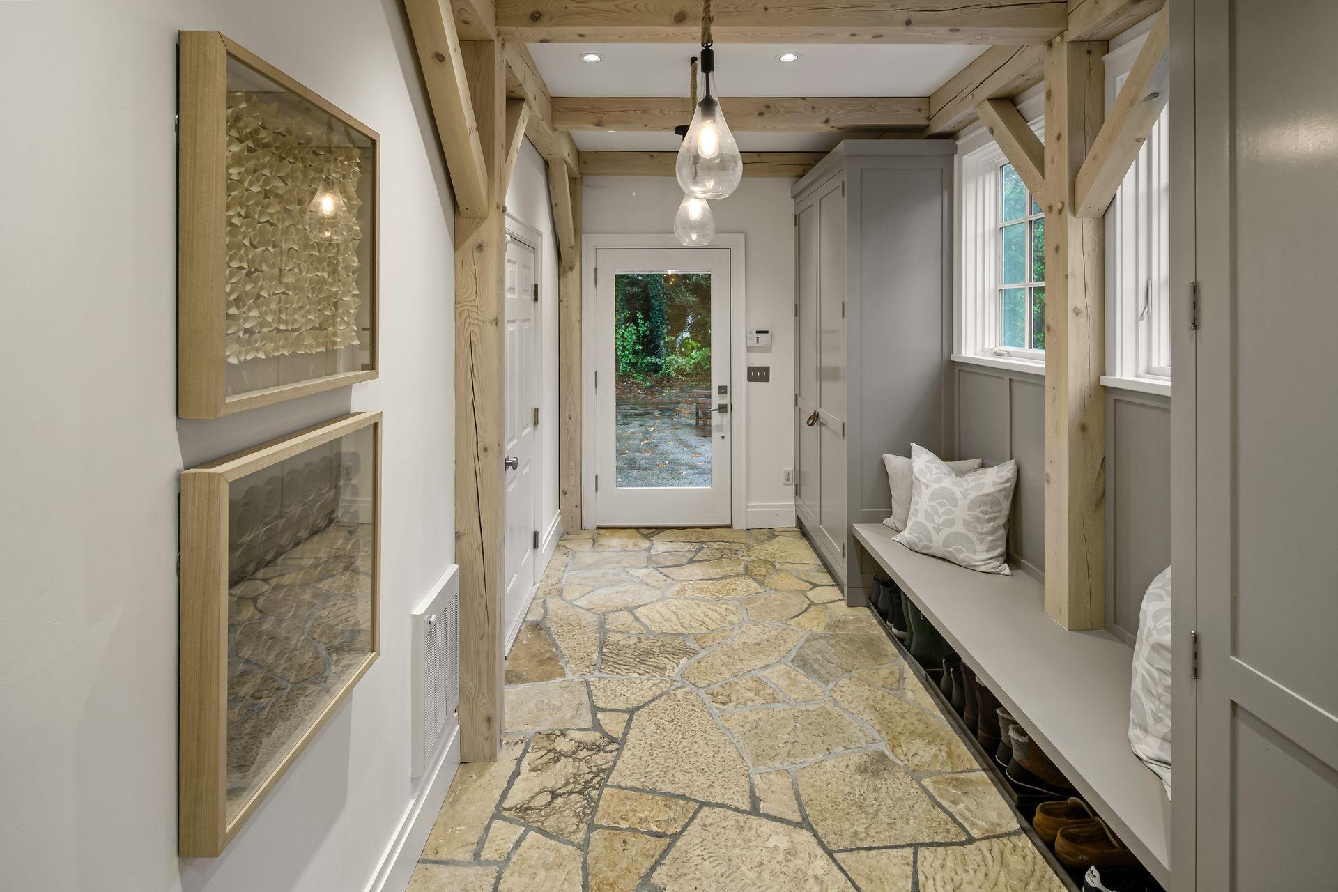 33 Tory Hole Road Darien, CT 06820 - Photo 22 of 51 a view of a hallway with wooden floor and a chandelier