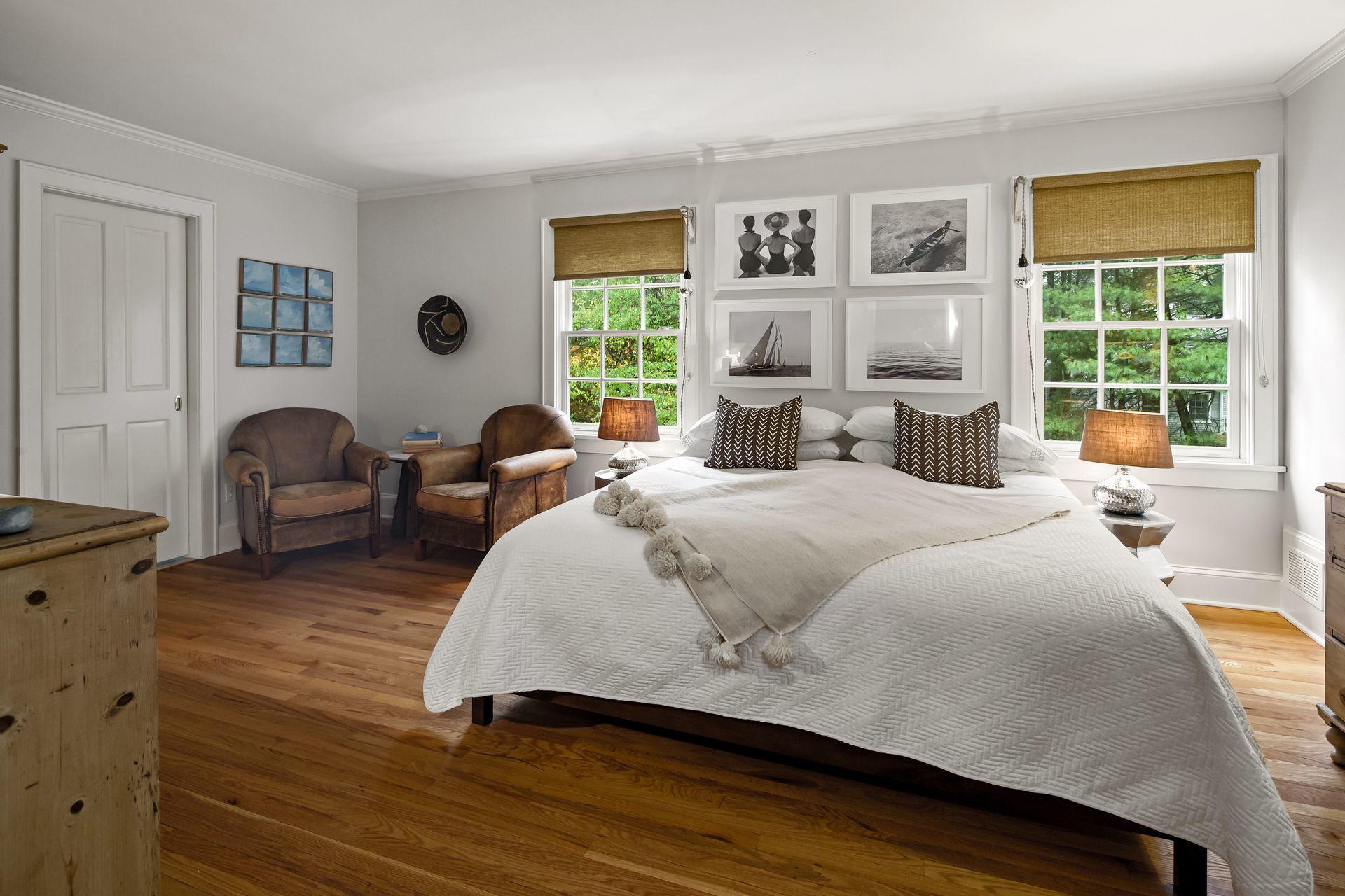 33 Tory Hole Road Darien, CT 06820 - Photo 26 of 51 a spacious bedroom with a bed a dresser next to a window