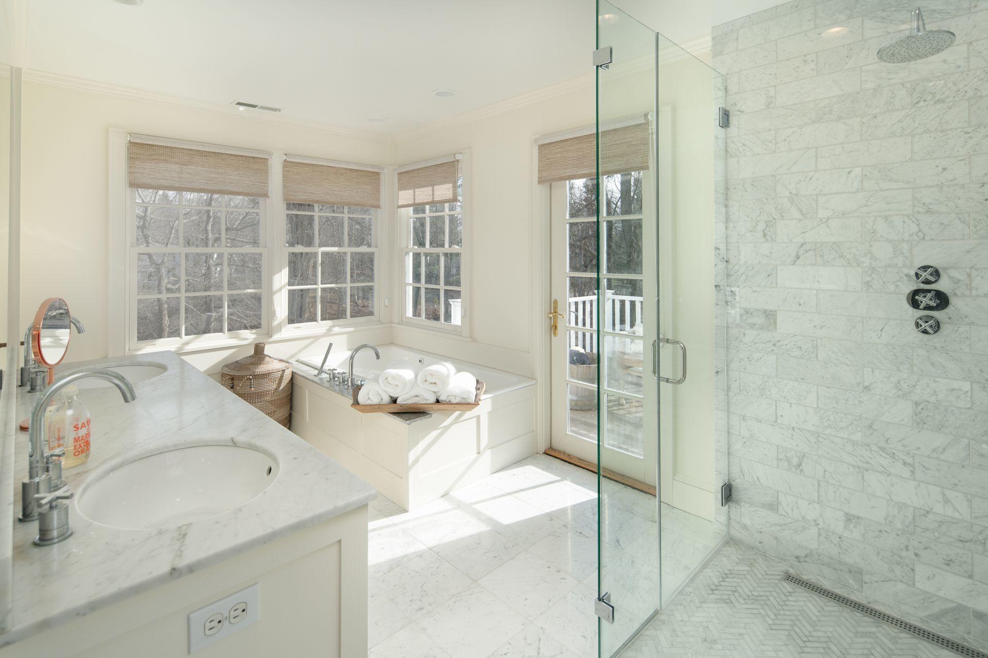 33 Tory Hole Road Darien, CT 06820 - Photo 27 of 51 a bathroom with a granite countertop sink a mirror and a shower