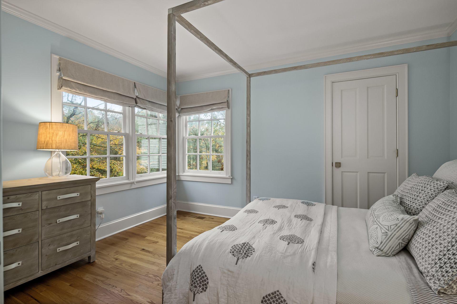 33 Tory Hole Road Darien, CT 06820 - Photo 29 of 51 a bedroom with a bed and a window