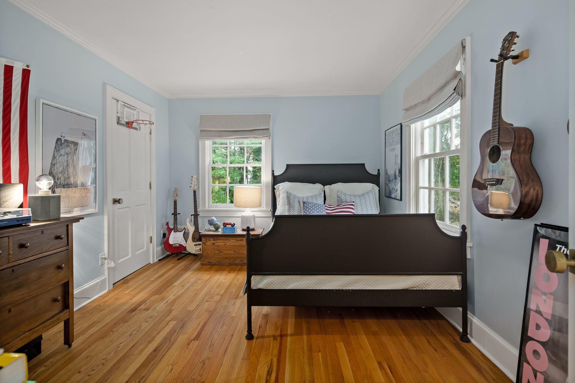 33 Tory Hole Road Darien, CT 06820 - Photo 31 of 51 a bedroom with a bed and wooden floor