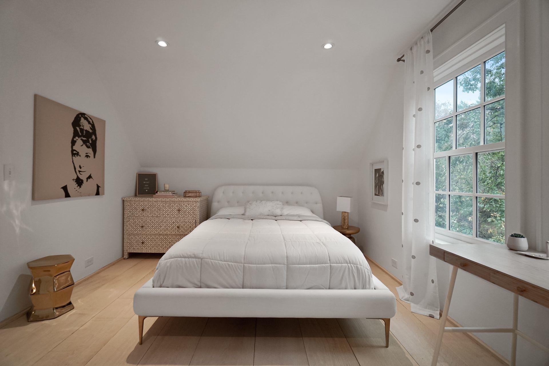 33 Tory Hole Road Darien, CT 06820 - Photo 33 of 51 a bedroom with a bed and window