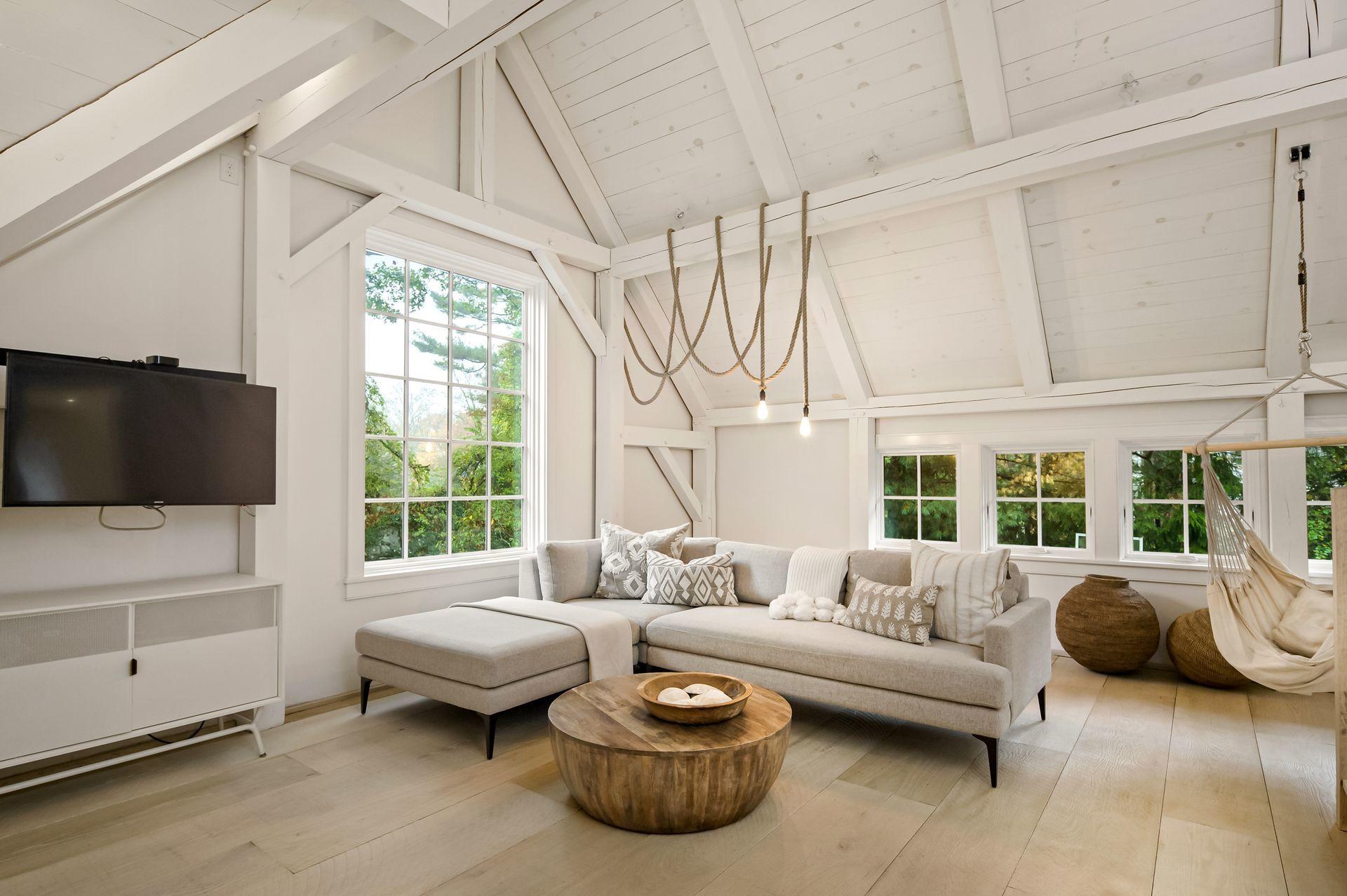 33 Tory Hole Road Darien, CT 06820 - Photo 39 of 51 a living room with furniture and a flat screen tv