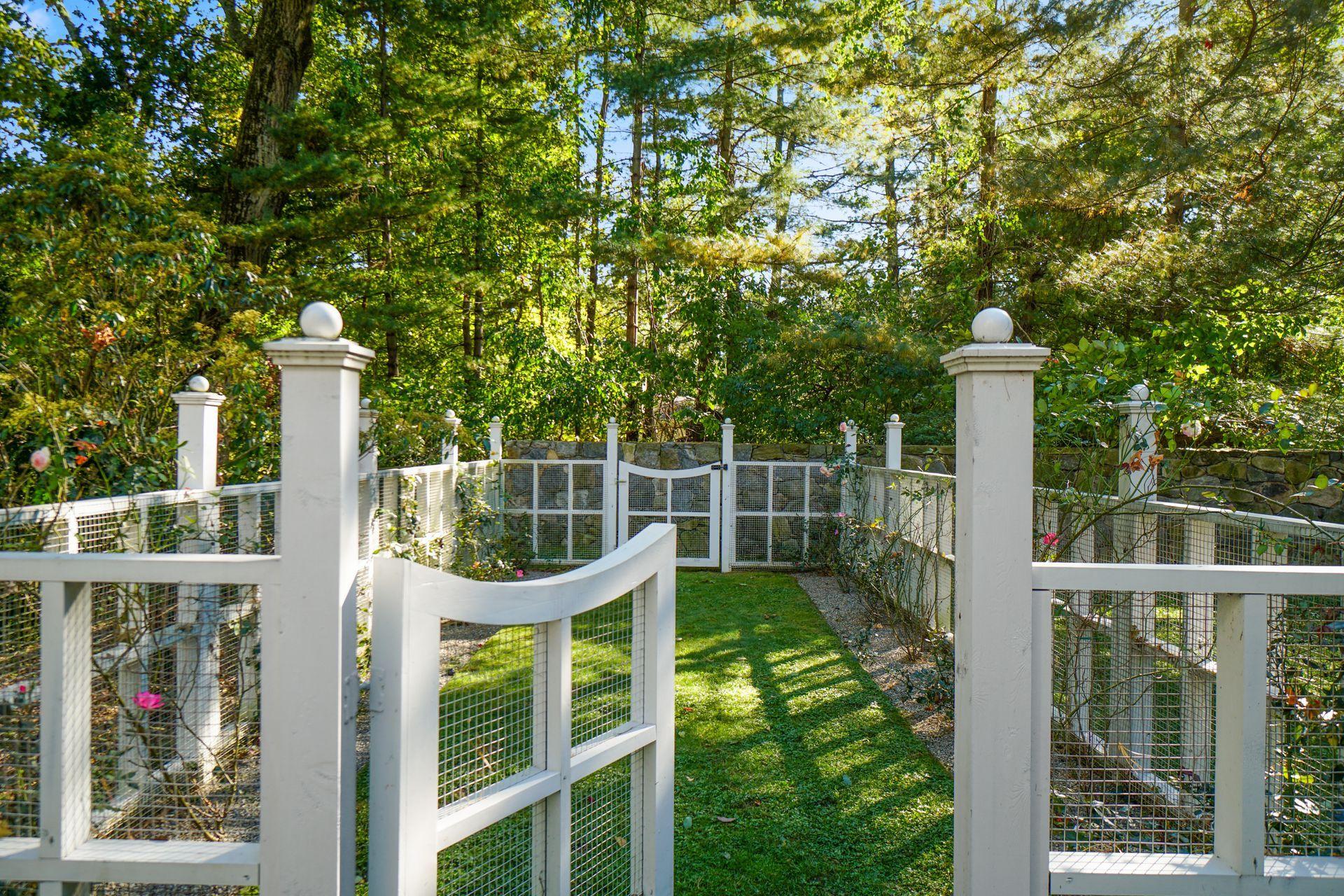 33 Tory Hole Road Darien, CT 06820 - Photo 45 of 51 a view of a deck with a large window and wooden fence
