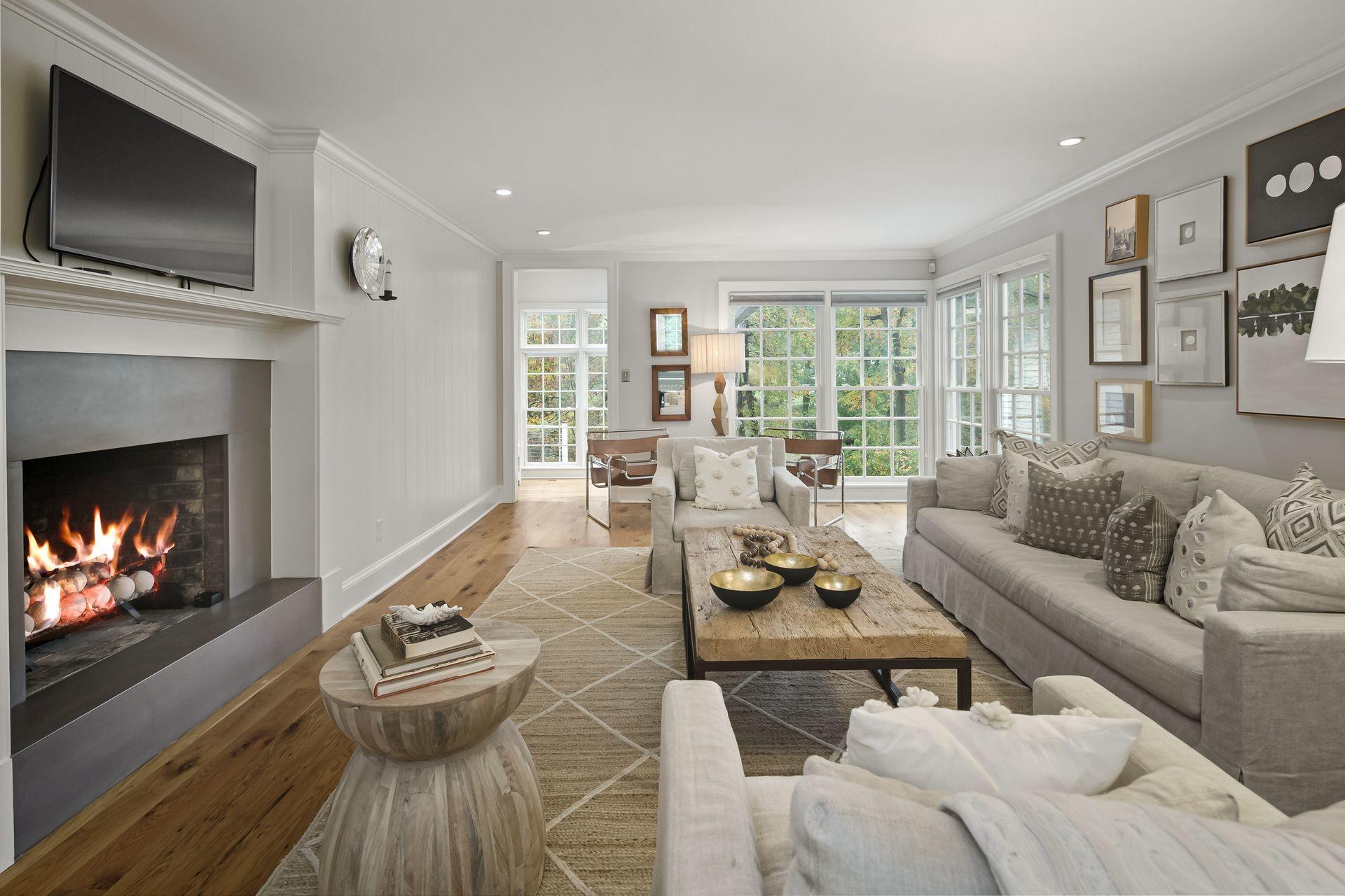 33 Tory Hole Road Darien, CT 06820 - Photo 6 of 51 a living room with furniture fireplace and flat screen tv