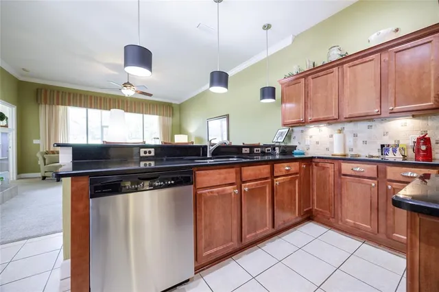 a kitchen with stainless steel appliances granite countertop a sink and a counter
