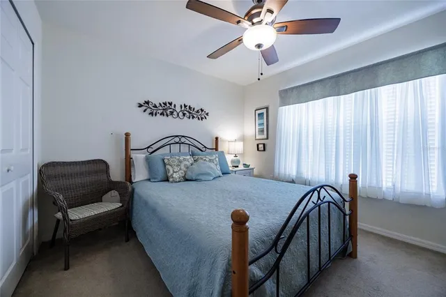 a bedroom with furniture and a window