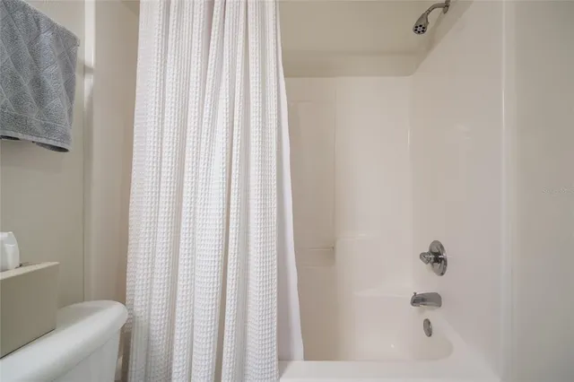 a bathroom with a shower curtain