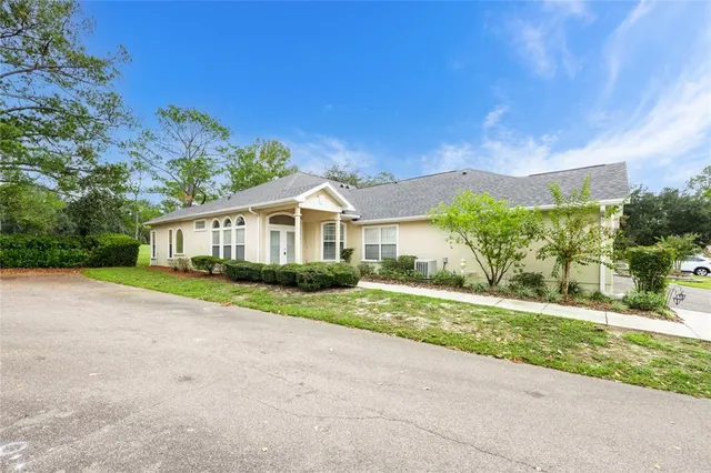 a front view of a house with a yard and porch