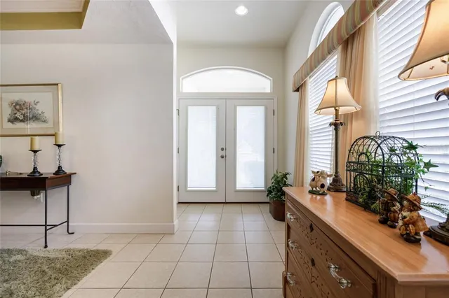 a lobby with furniture and a potted plant