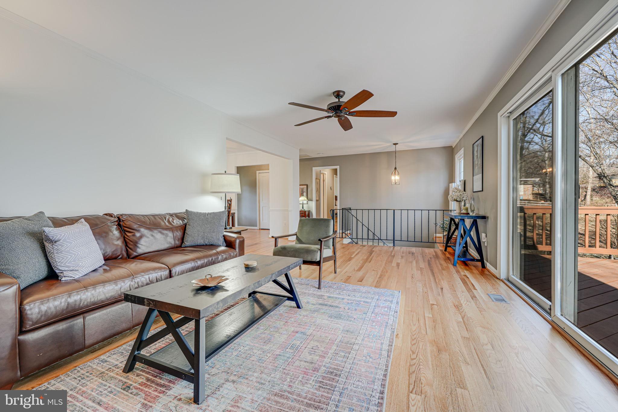 11000 Ring Road Reston, VA 20190 - Photo 12 of 53 a living room with furniture and a wooden floor