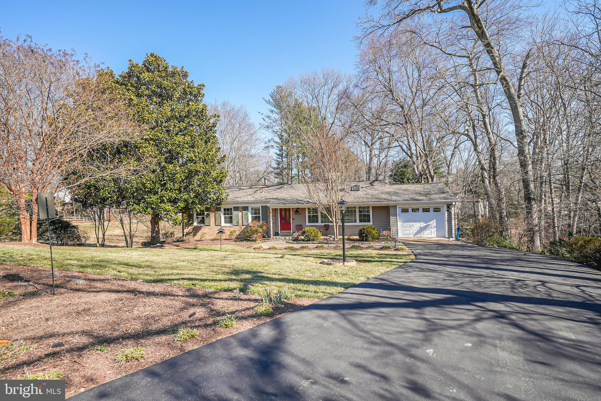 11000 Ring Road Reston, VA 20190 - Photo 2 of 53 a front view of a house with a yard