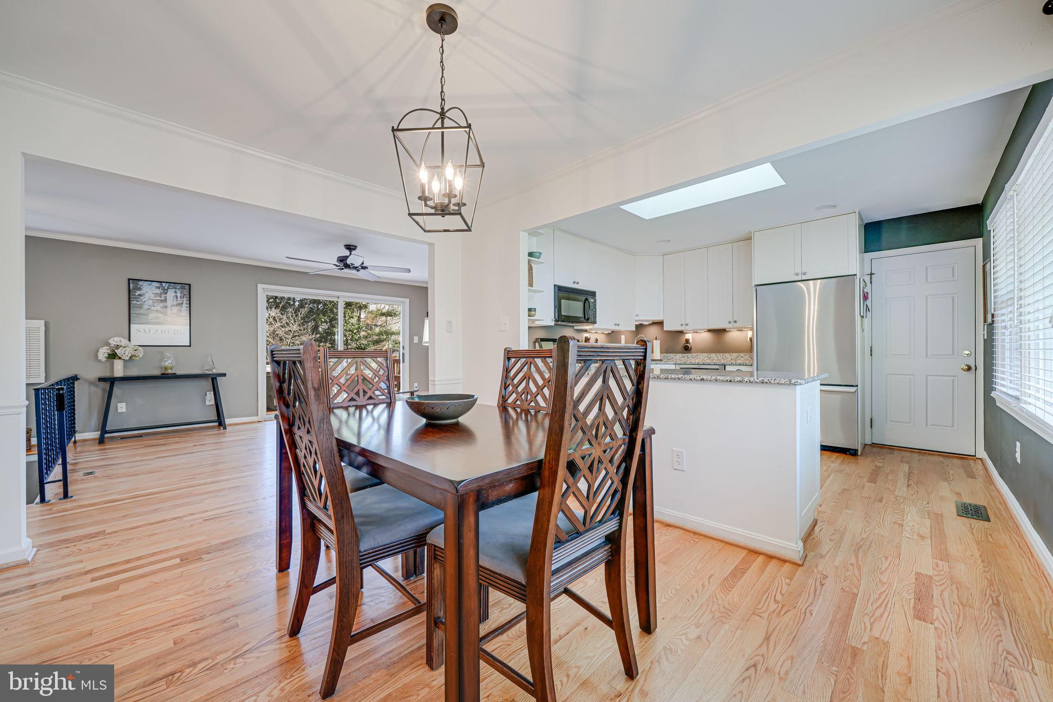 11000 Ring Road Reston, VA 20190 - Photo 5 of 53 a view of a dining room with furniture and wooden floor
