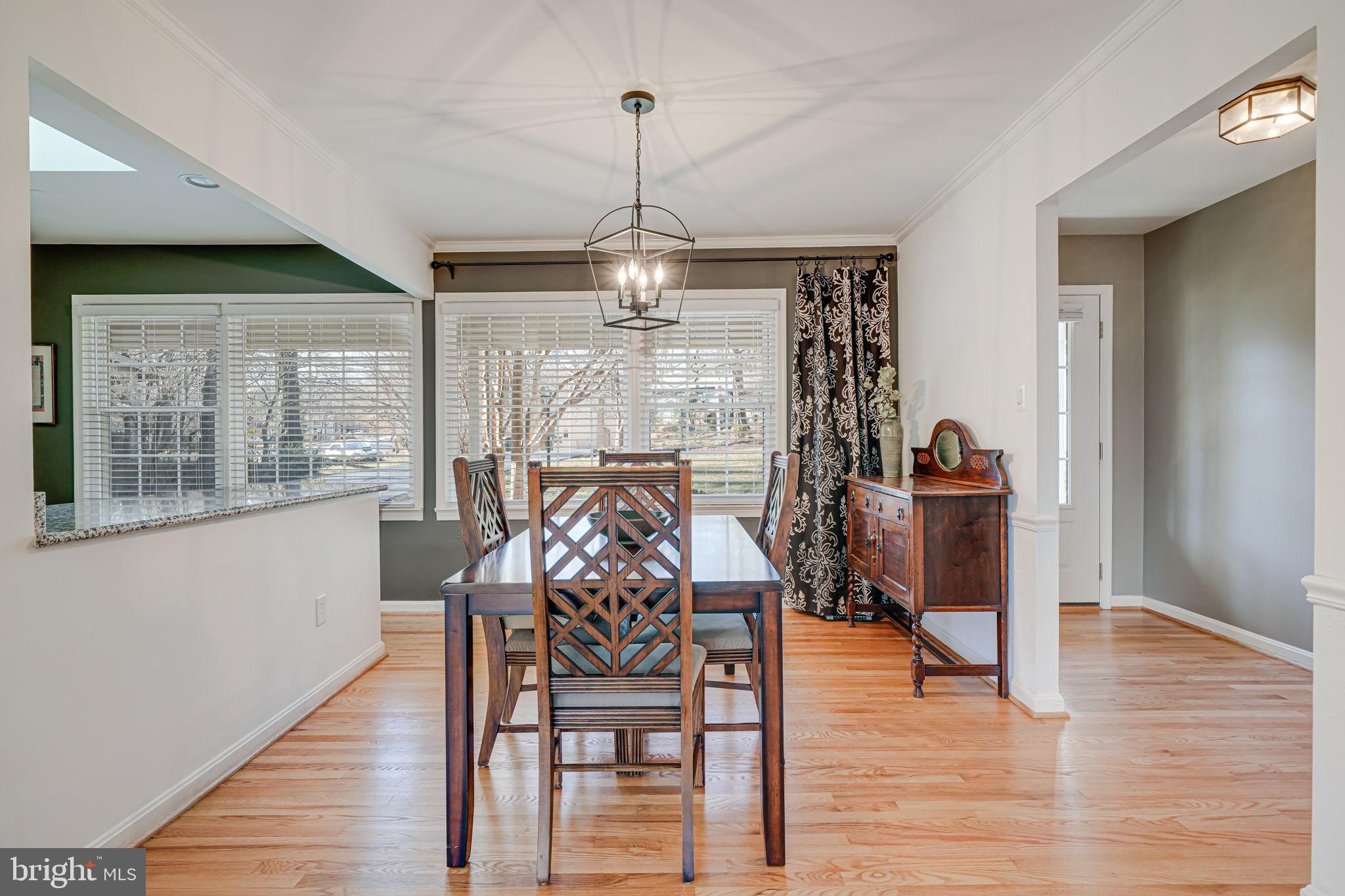 11000 Ring Road Reston, VA 20190 - Photo 8 of 53 a view of a dining room with furniture window and wooden floor