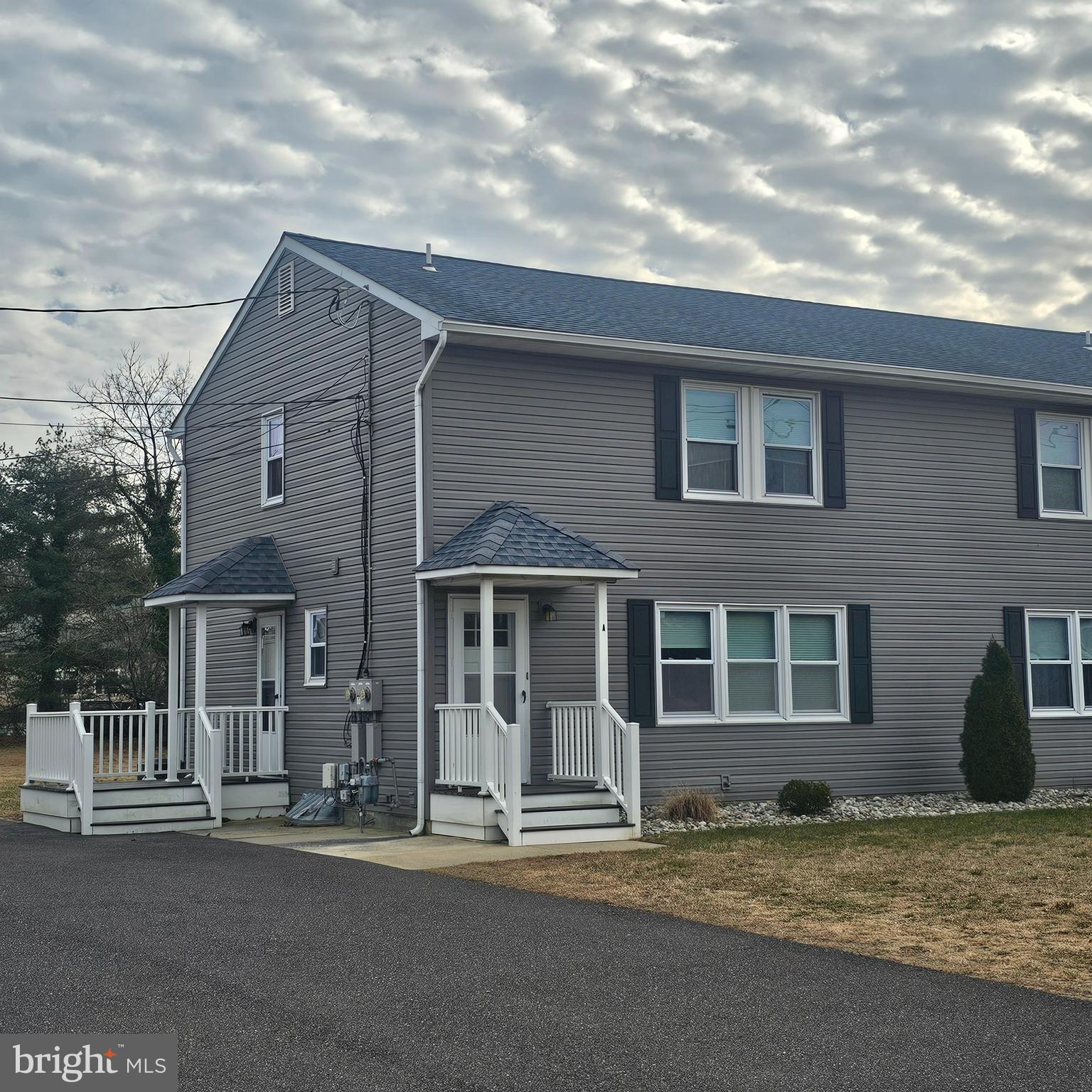 1565 South Main Road Vineland, NJ 08360 - Photo 3 of 15 a front view of a house with a garden
